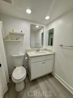20702 El Toro, Unit 239 Lake Forest, CA 92630 - Photo 18 of 27 a spacious bathroom with a toilet sink and mirror