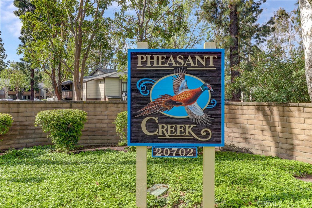 20702 El Toro, Unit 239 Lake Forest, CA 92630 - Photo 27 of 27 a view of outdoor space with signage and flags