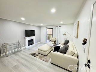 20702 El Toro, Unit 239 Lake Forest, CA 92630 - Photo 3 of 27 a living room with furniture and a flat screen tv