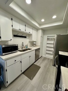 20702 El Toro, Unit 239 Lake Forest, CA 92630 - Photo 8 of 27 a kitchen with cabinets and appliances