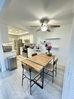 20702 El Toro, Unit 239 Lake Forest, CA 92630 - Photo 10 of 27 a view of a dining room with furniture and wooden floor