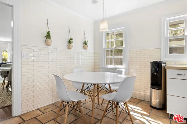 a view of a dining room with furniture and window