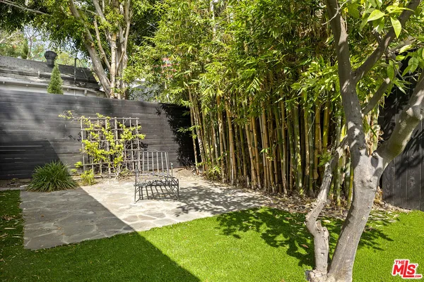 a view of yard with patio