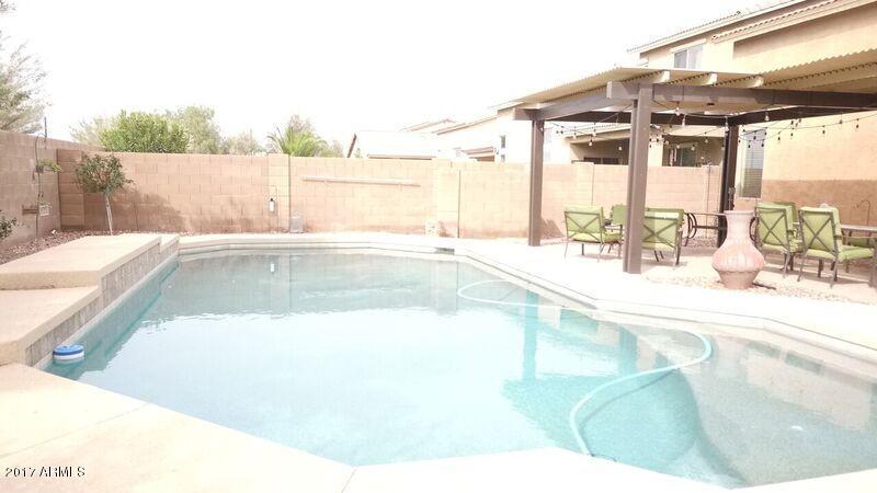 45401 Miramar Road Maricopa, AZ 85139 - Photo 32 of 44 45401WMiramarRdBackyardsideview