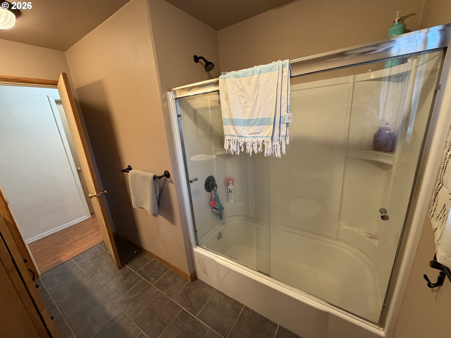 92738 Knapp Road Port Orford, OR 97465 - Photo 17 of 34 a bathroom with a glass door shower and a tub