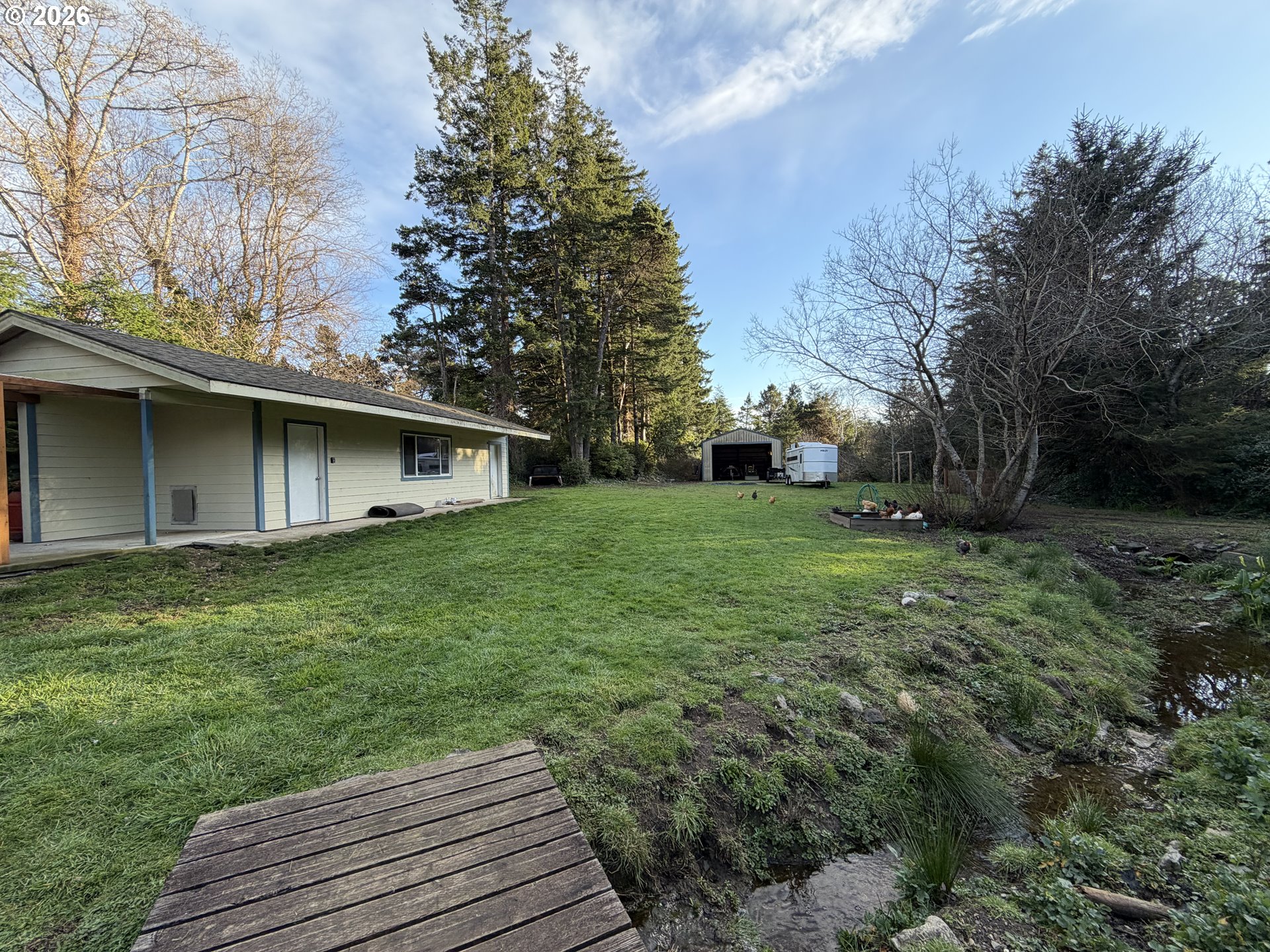 92738 Knapp Road Port Orford, OR 97465 - Photo 26 of 34 a view of a house with a yard