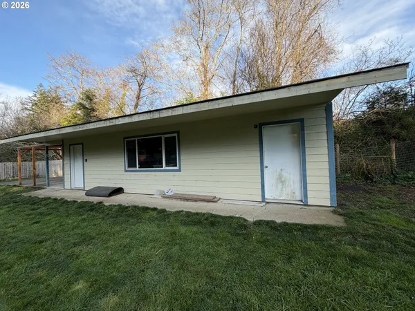 a backyard of a house with lots of green space