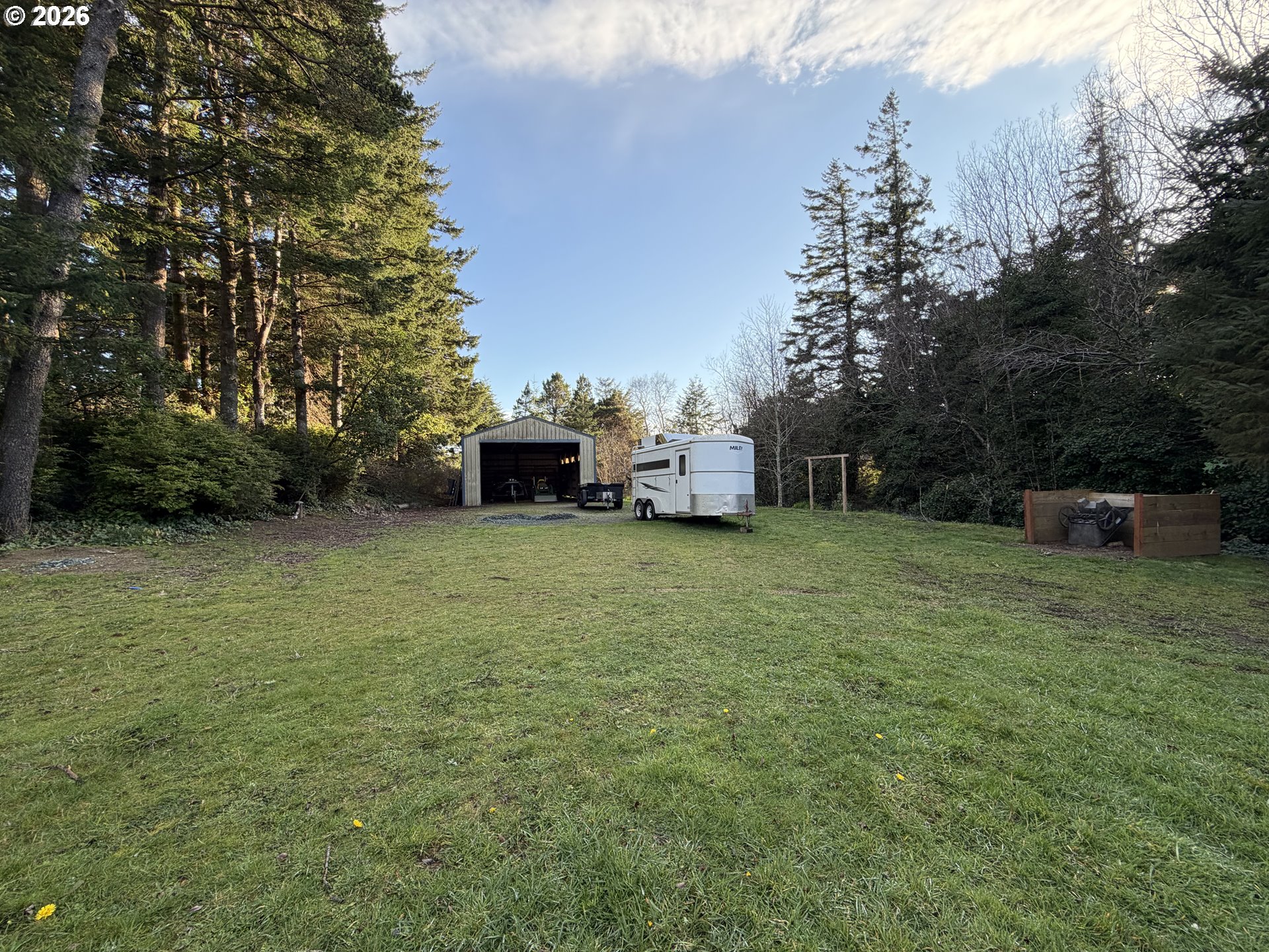 92738 Knapp Road Port Orford, OR 97465 - Photo 29 of 34 a view of a backyard with a garden and entertaining space