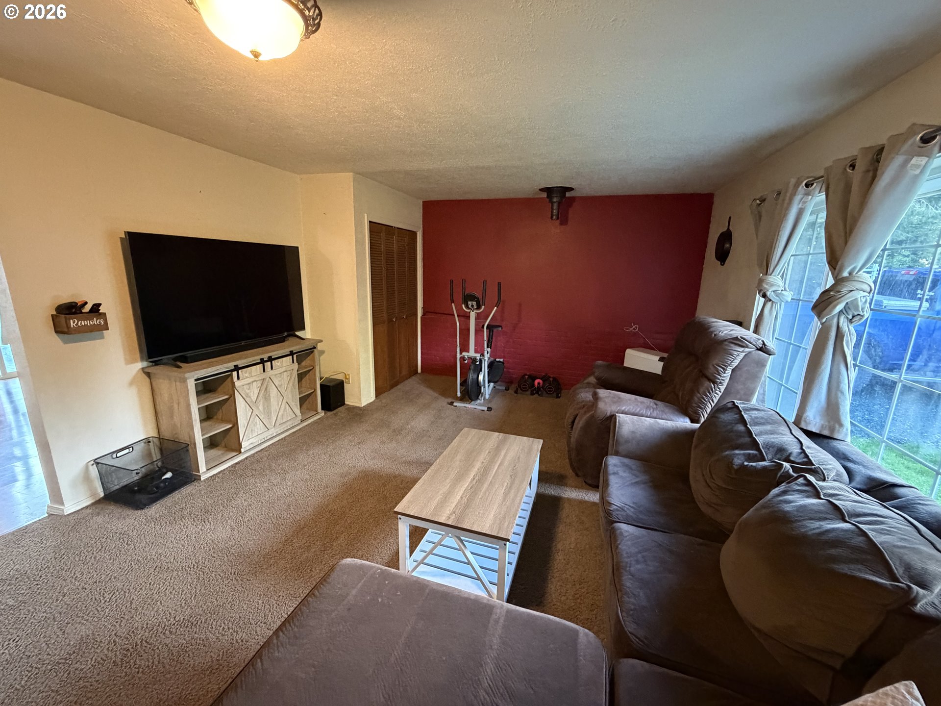 92738 Knapp Road Port Orford, OR 97465 - Photo 4 of 34 a living room with furniture and a flat screen tv