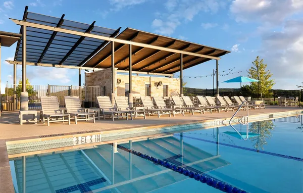 a view of a swimming pool with a patio