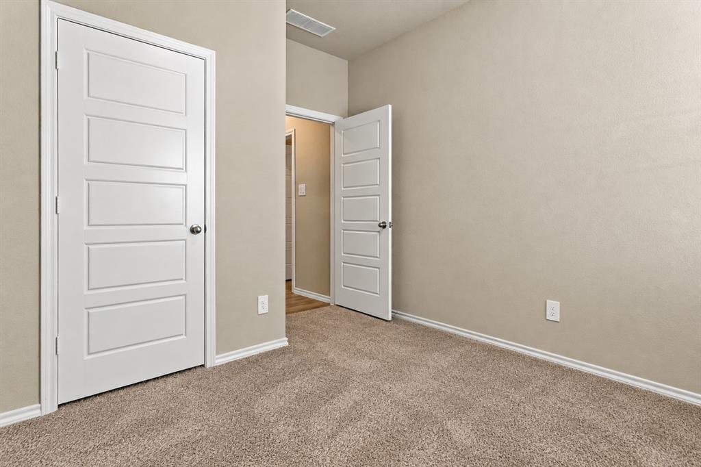 15932 Stableford Road Justin, TX 76247 - Photo 22 of 35 Neutral wall color, carpeted flooring, white trim, and white panel doors