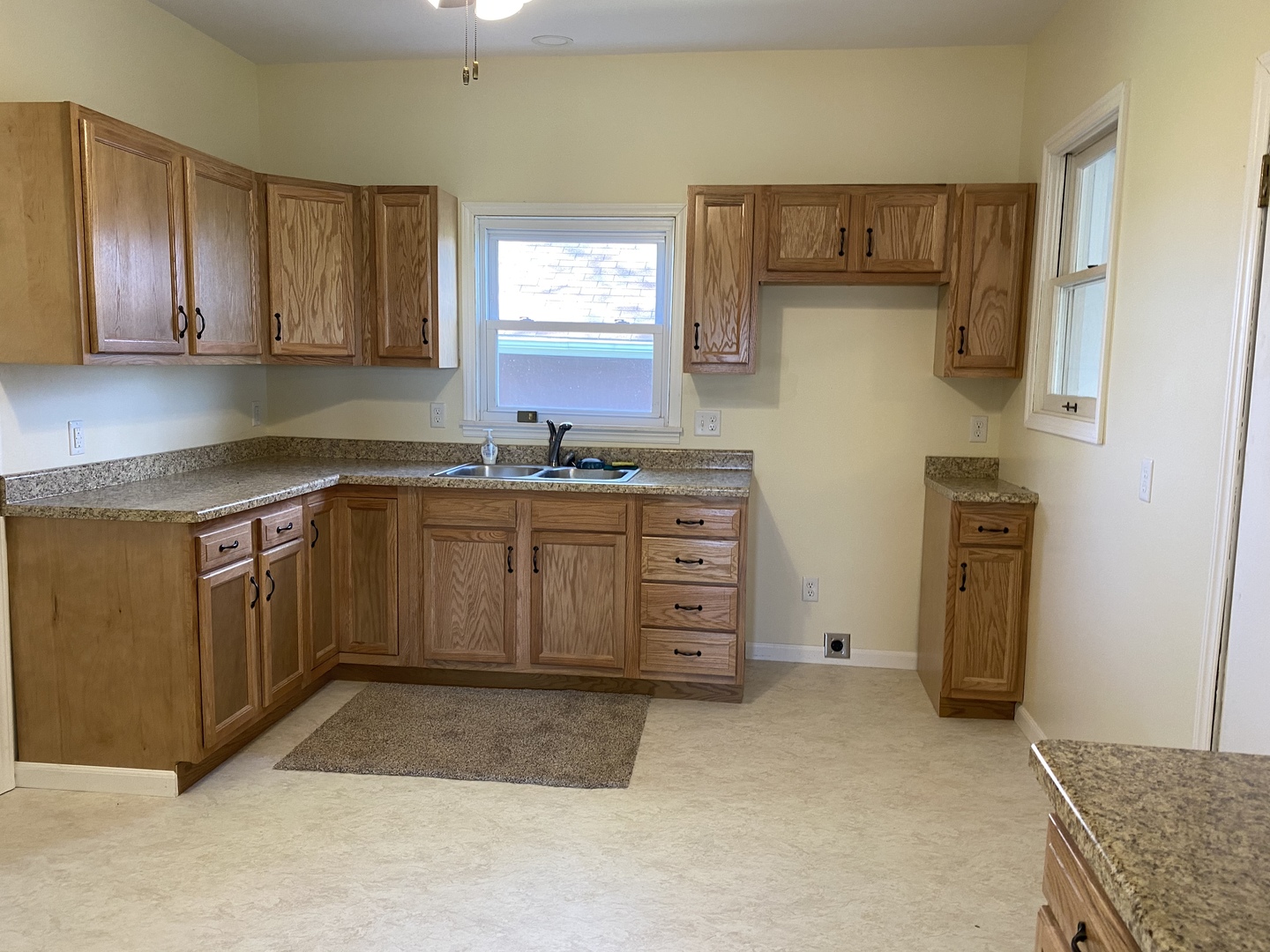 18240 Hurd Road Prophetstown, IL 61277 - Photo 2 of 18 a kitchen with stainless steel appliances granite countertop a stove a sink and a refrigerator with wooden cabinets