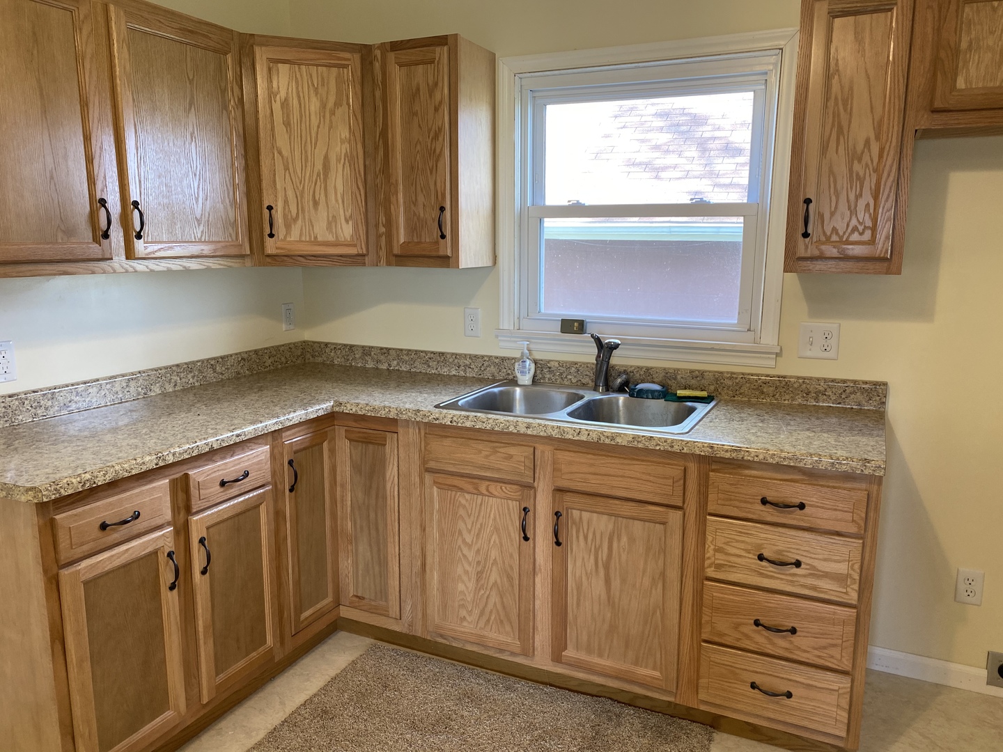 18240 Hurd Road Prophetstown, IL 61277 - Photo 3 of 18 a kitchen with granite countertop cabinets and window
