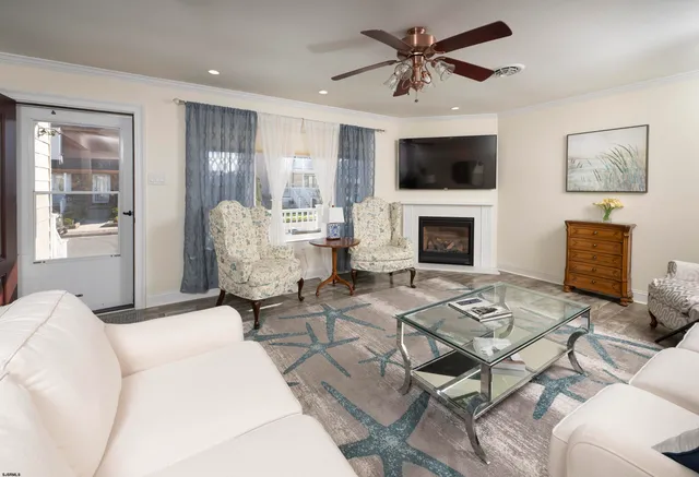 a spacious bedroom with a bed and a chandelier