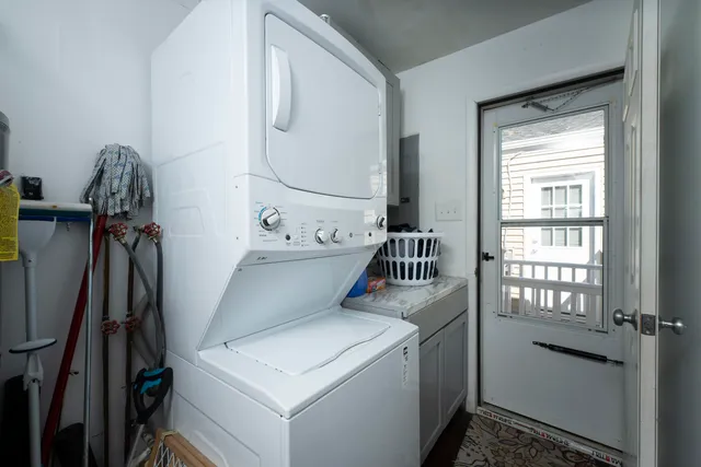 a outdoor space with patio the couches and kitchen view with wooden floor