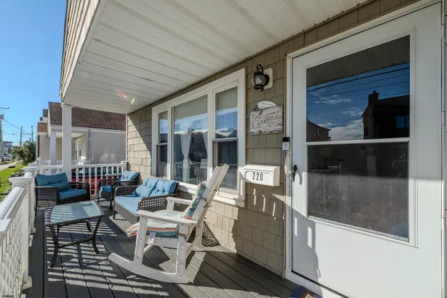 a view of a chairs and table in backyard