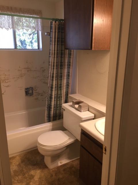 16235 Valley Ranch Road Santa Clarita, CA 91387 - Photo 11 of 24 a bathroom with a toilet a sink and bathtub