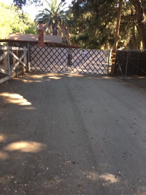16235 Valley Ranch Road Santa Clarita, CA 91387 - Photo 7 of 24 a view of a door in the yard