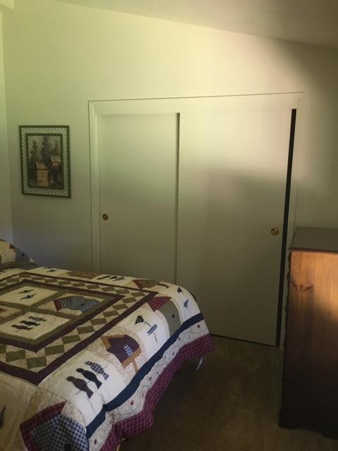 16235 Valley Ranch Road Santa Clarita, CA 91387 - Photo 10 of 24 a bed sitting in a bedroom next to a bathroom
