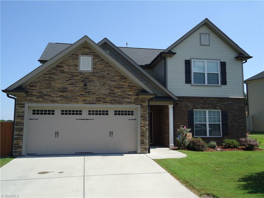 4573 Silo Ridge Clemmons, NC 27012 - Photo 1 of 27 Front with rock and brick combination.