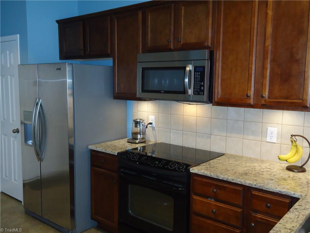 4573 Silo Ridge Clemmons, NC 27012 - Photo 13 of 27 Kitchen with granite counter tops.