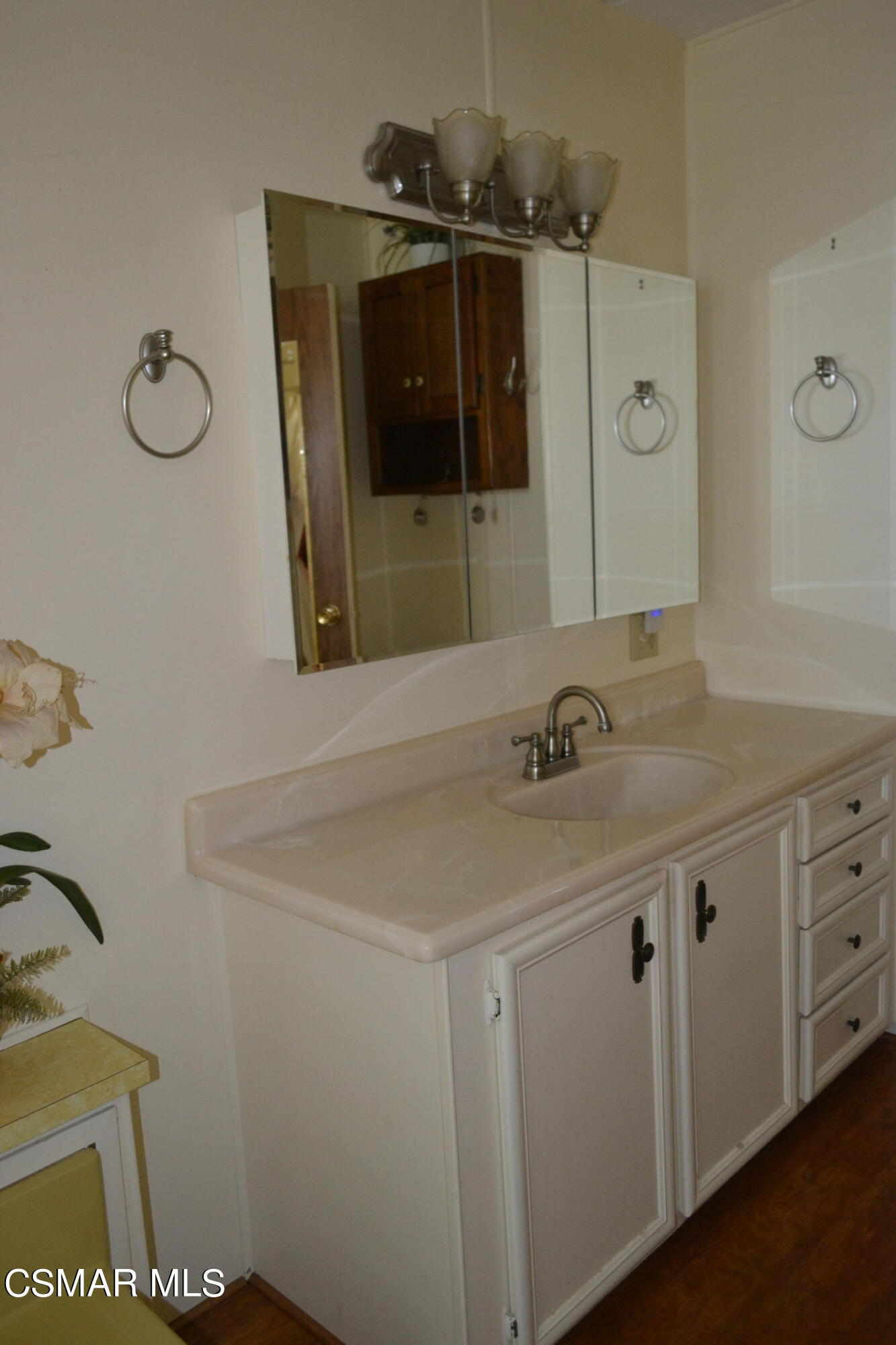 6480 Katherine Road, Unit 44 Simi Valley, CA 93063 - Photo 12 of 32 a bathroom with a sink and a mirror