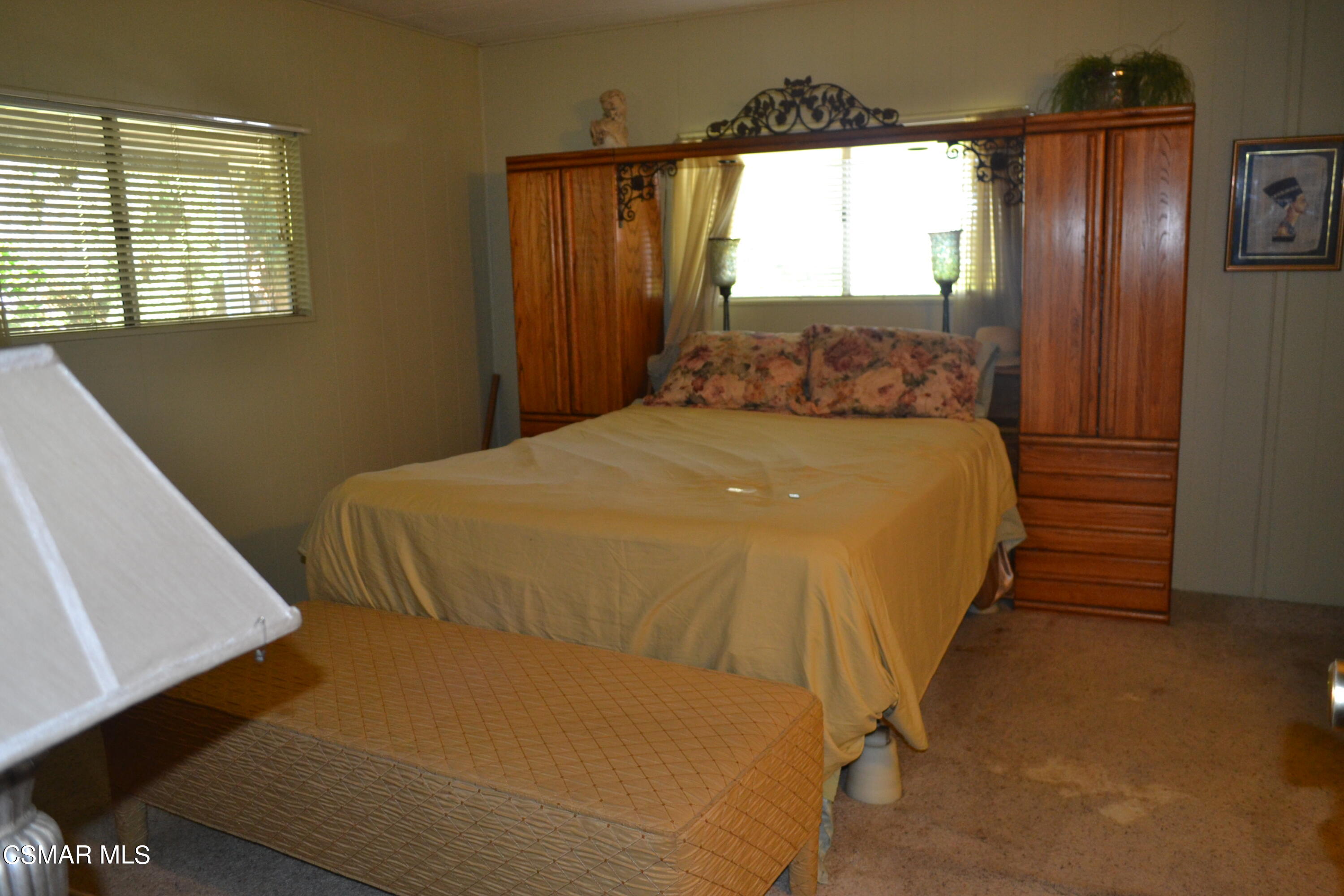 6480 Katherine Road, Unit 44 Simi Valley, CA 93063 - Photo 13 of 32 a bed sitting in a spacious bedroom next to a window