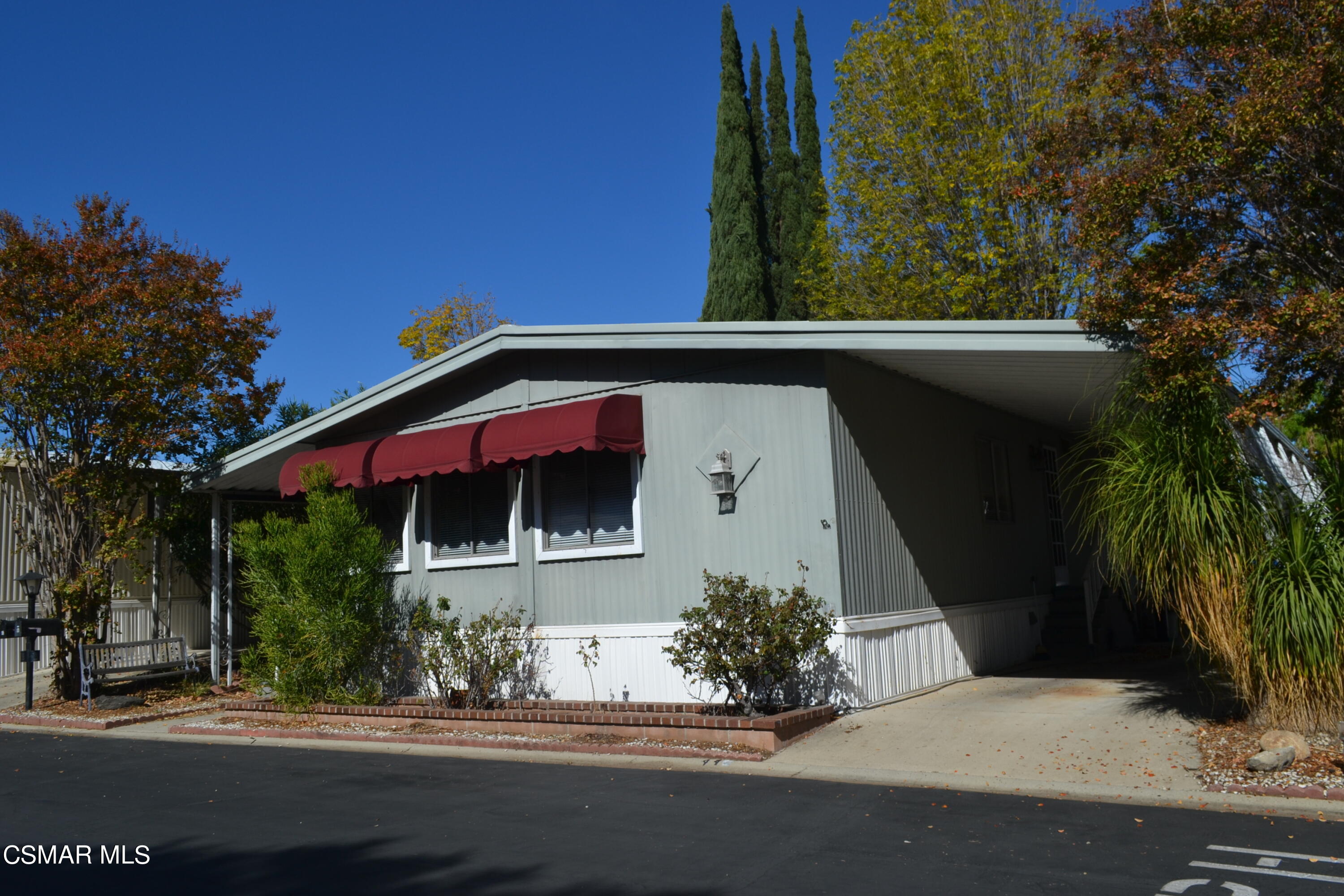 6480 Katherine Road, Unit 44 Simi Valley, CA 93063 - Photo 22 of 32 a front view of a house with a garden