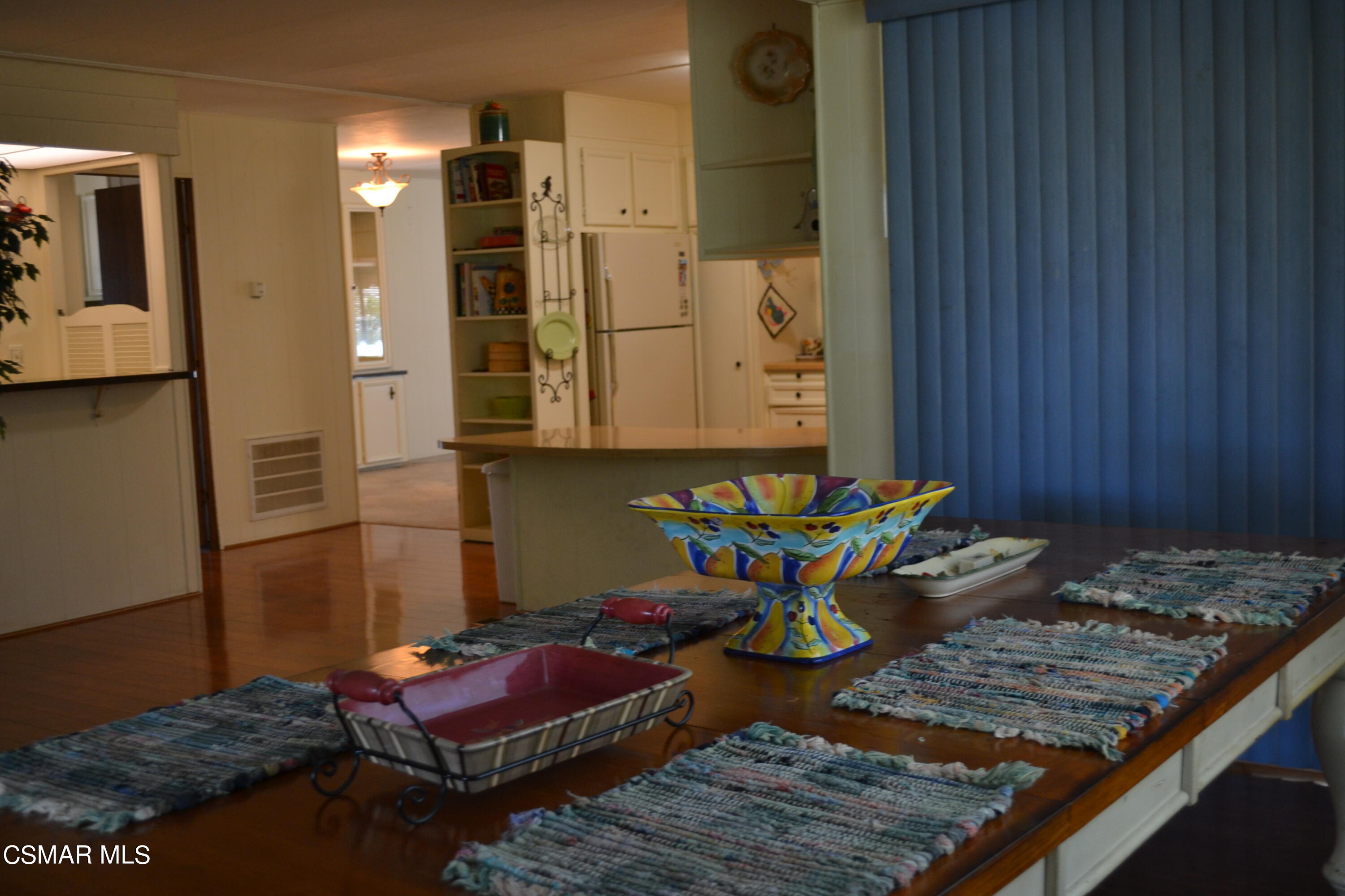 6480 Katherine Road, Unit 44 Simi Valley, CA 93063 - Photo 7 of 32 a room with table and chairs
