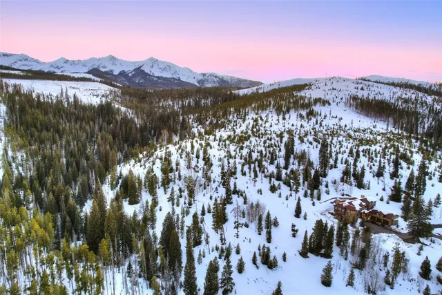 a view of a town with mountains in the background