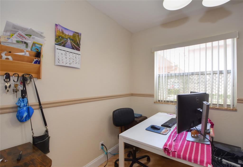 357 Saxony Lane, Unit 357 Delray Beach, FL 33446 - Photo 16 of 35 a view of a workspace with furniture and a window