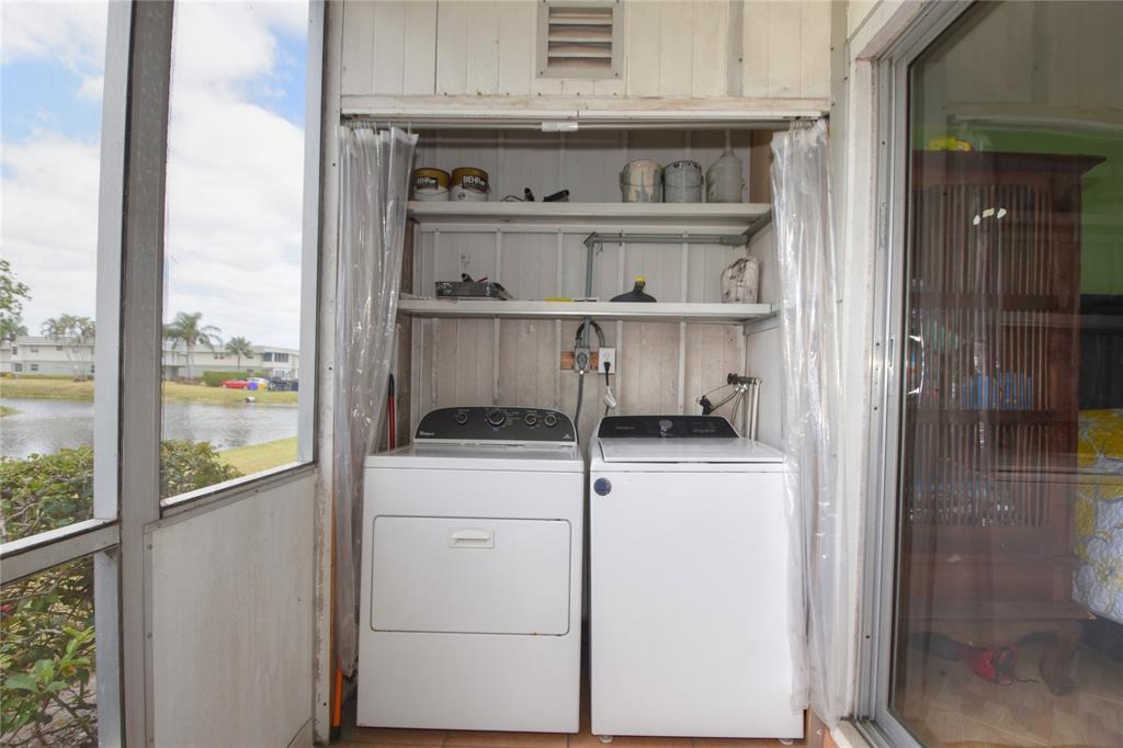 357 Saxony Lane, Unit 357 Delray Beach, FL 33446 - Photo 26 of 35 a utility room with dryer and washer