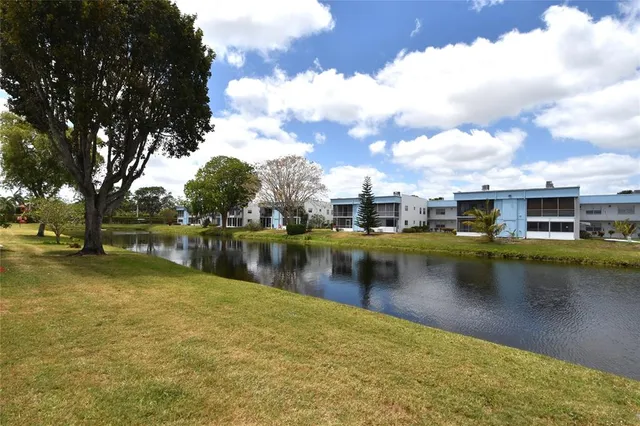 a view of a lake with houses in the background