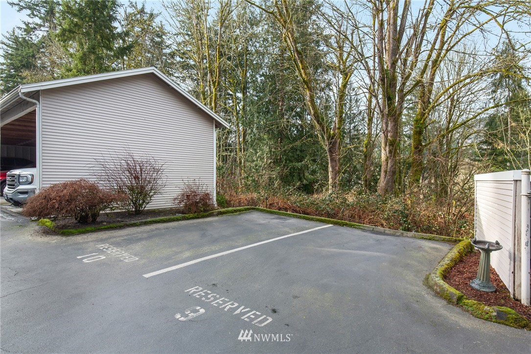 601 12th Avenue Northwest, Unit C 1 Issaquah, WA 98027 - Photo 17 of 17 a view of a house with backyard and trees