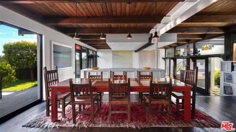 a view of a dining room with furniture window and outdoor space