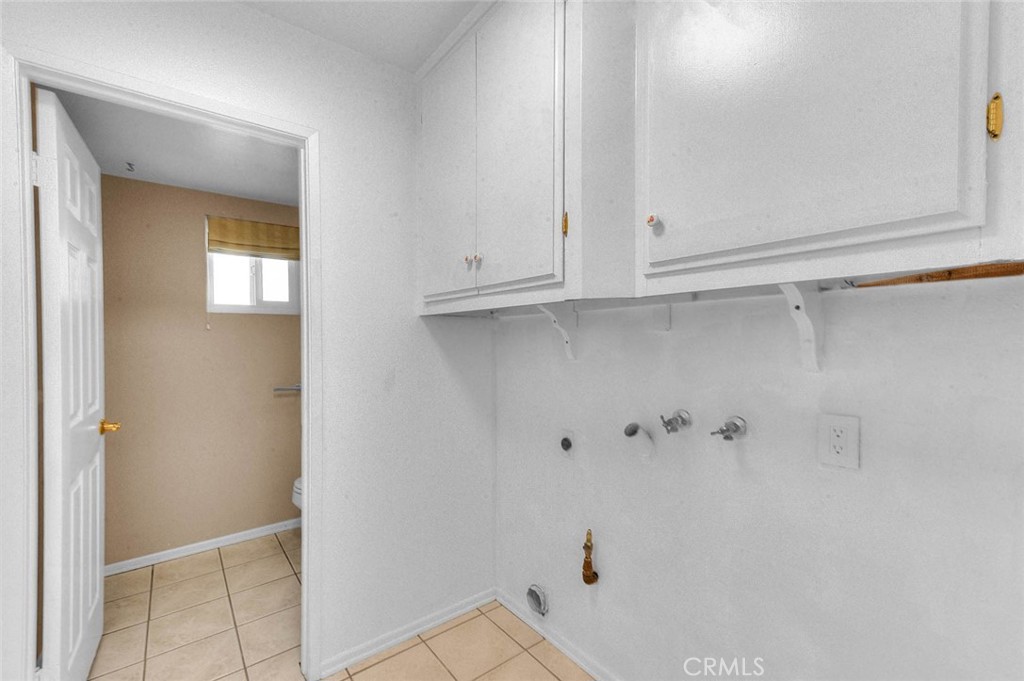 30673 Del Rey Road Temecula, CA 92591 - Photo 22 of 47 Opposite From Pantry Is Utility Room For Washer And Dryer. Overhead Cabinets. New Overhead LED Lighting. Easy Care Tiled Flooring. Door Leads To Powder Room.
