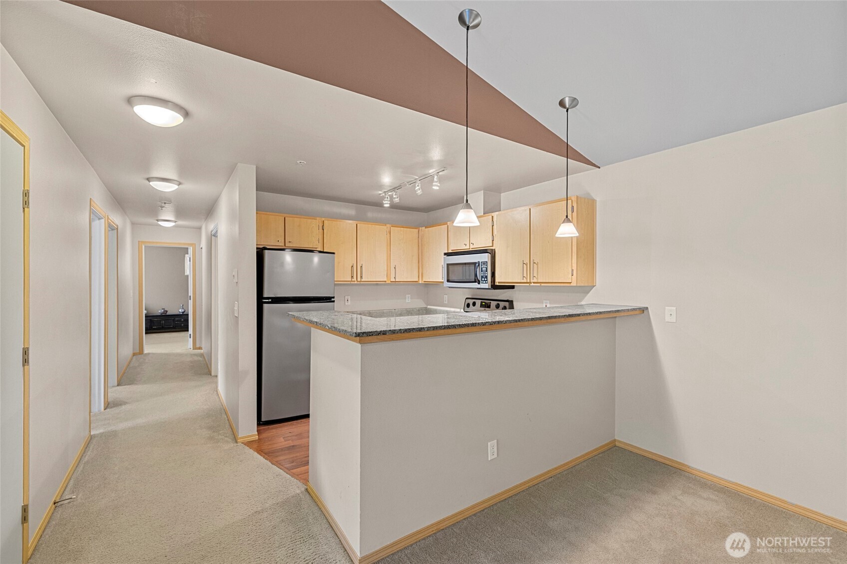 10709 Valley View Road, Unit B403 Bothell, WA 98011 - Photo 13 of 32 a view of a kitchen with a sink