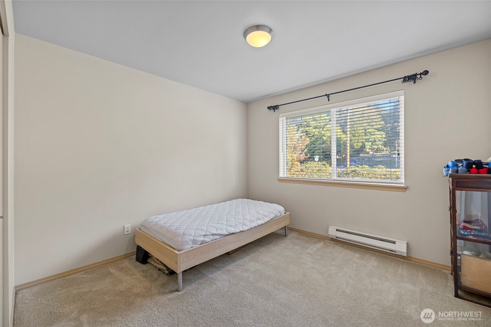 10709 Valley View Road, Unit B403 Bothell, WA 98011 - Photo 18 of 32 a room with a bed and a window