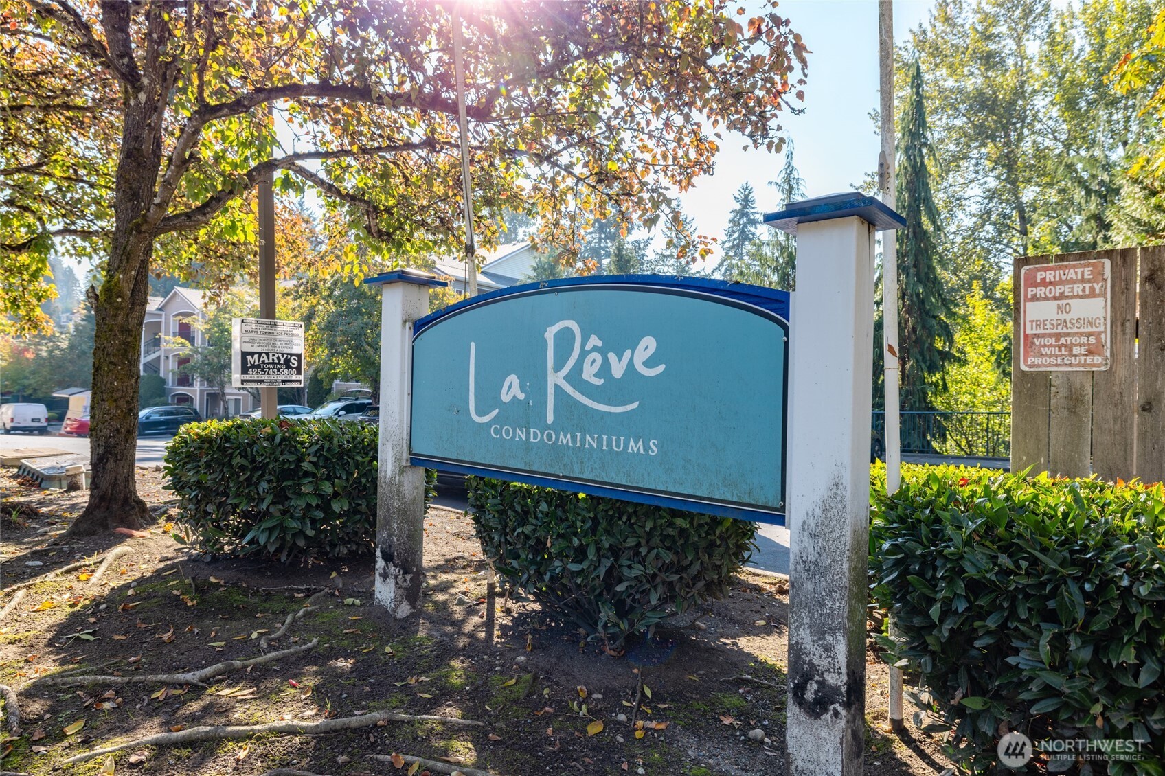 10709 Valley View Road, Unit B403 Bothell, WA 98011 - Photo 2 of 32 a sign broad on the side of the road