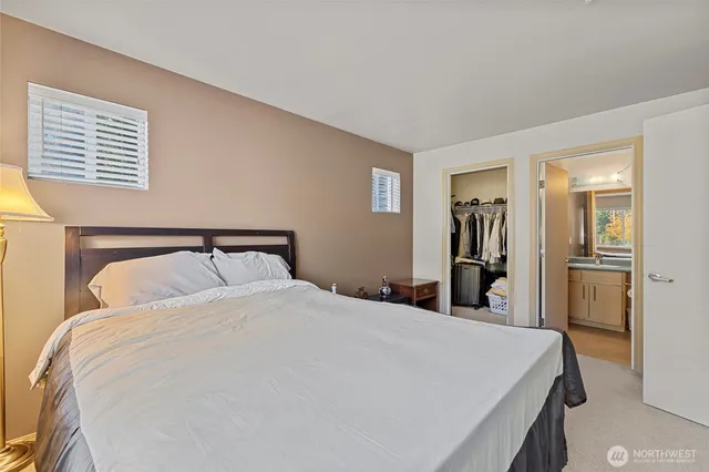 a bedroom with a bed and a closet