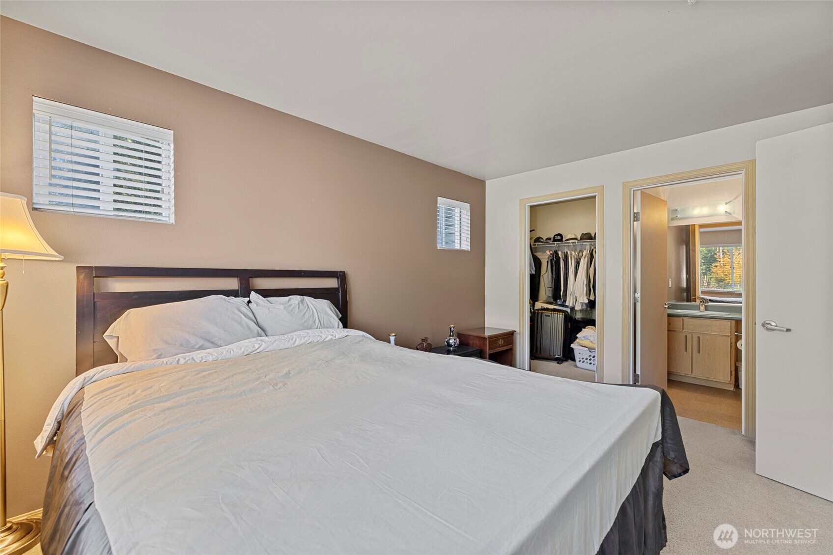 10709 Valley View Road, Unit B403 Bothell, WA 98011 - Photo 23 of 32 a bedroom with a bed and a closet