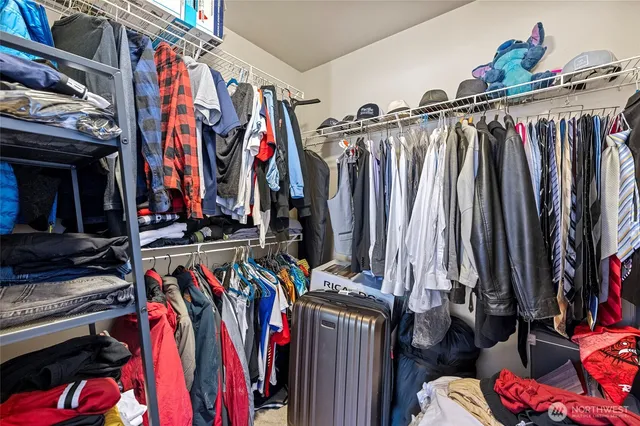 a bathroom with a toilet a sink and a mirror