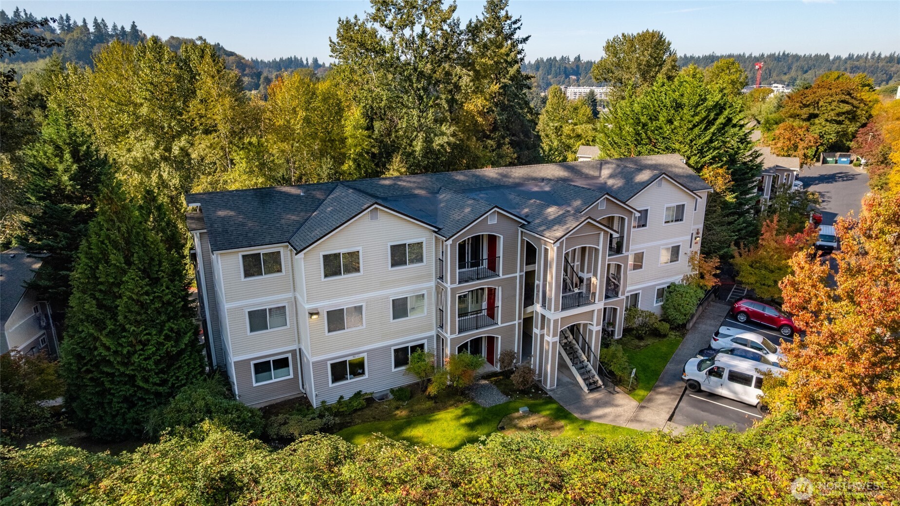 10709 Valley View Road, Unit B403 Bothell, WA 98011 - Photo 30 of 32 an aerial view of a house with a yard and sitting area
