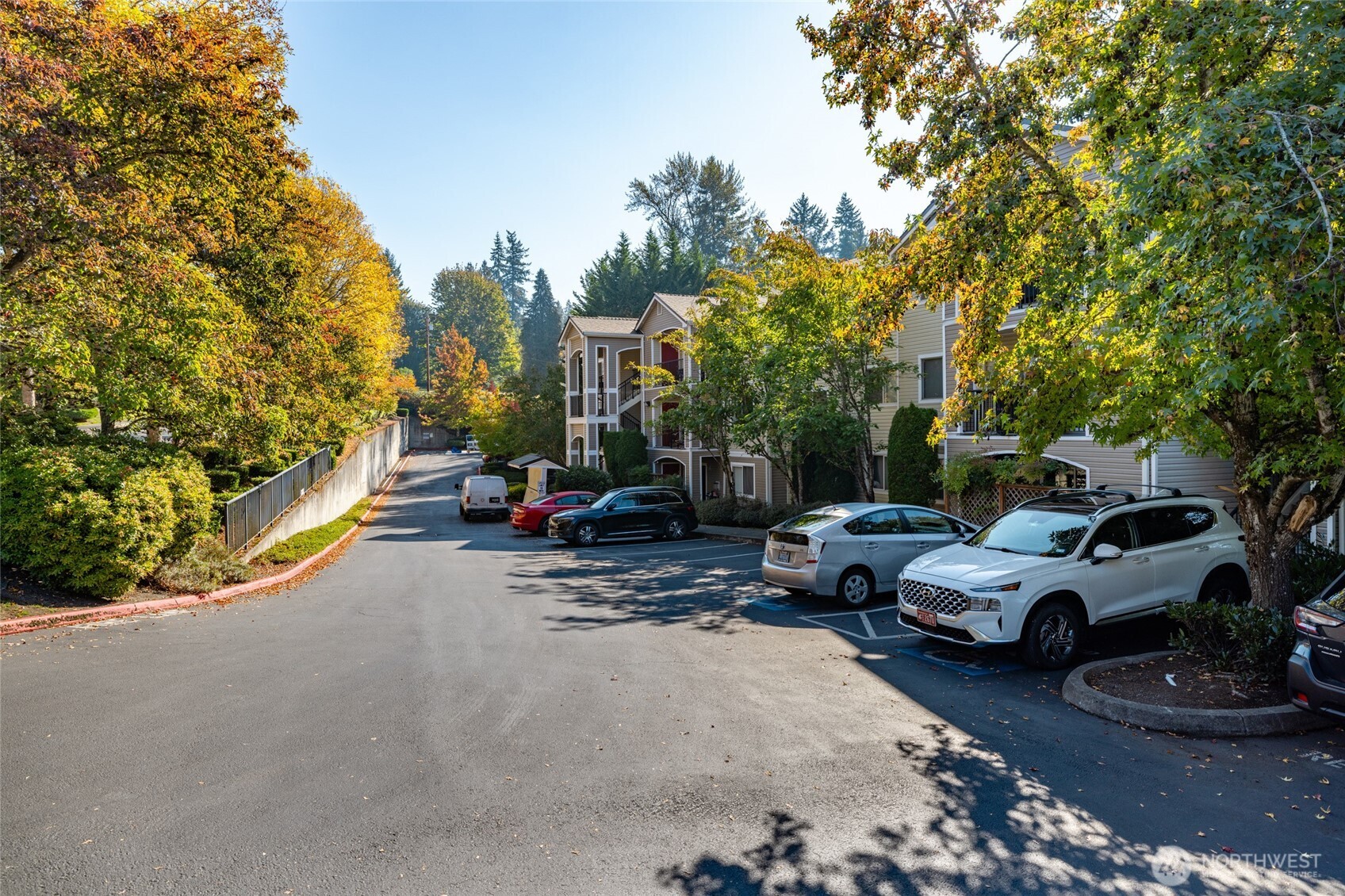 10709 Valley View Road, Unit B403 Bothell, WA 98011 - Photo 31 of 32 a view of street with parked cars