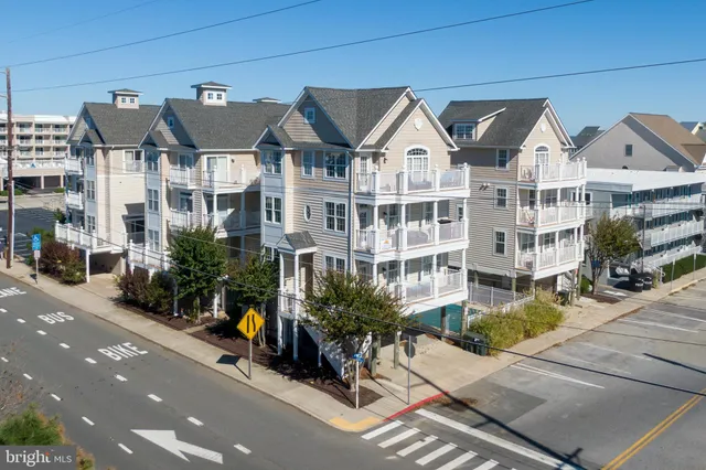 a view of multiple houses with a street