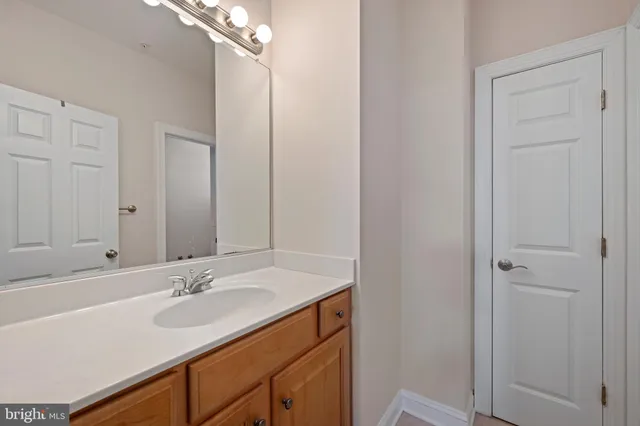 a bathroom with a sink double vanity and a mirror