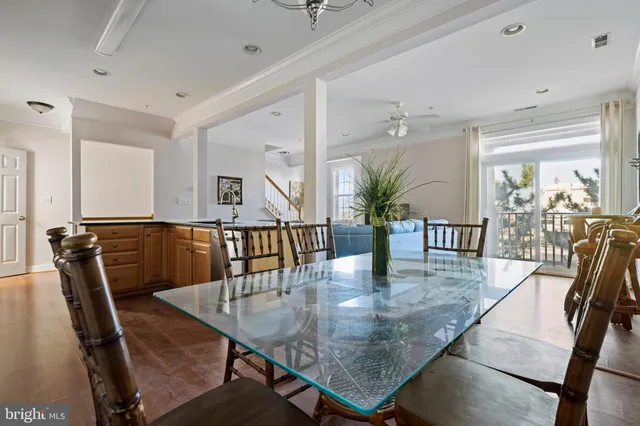 a dining room with furniture and wooden floor