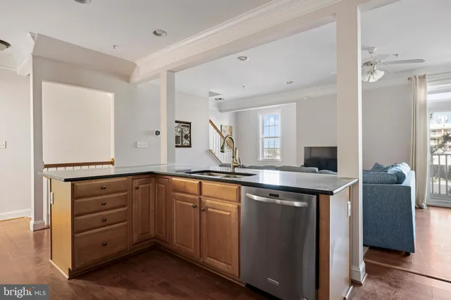 a spacious bathroom with a granite countertop sink and a mirror