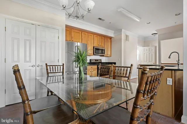 a dining room with furniture window and wooden floor