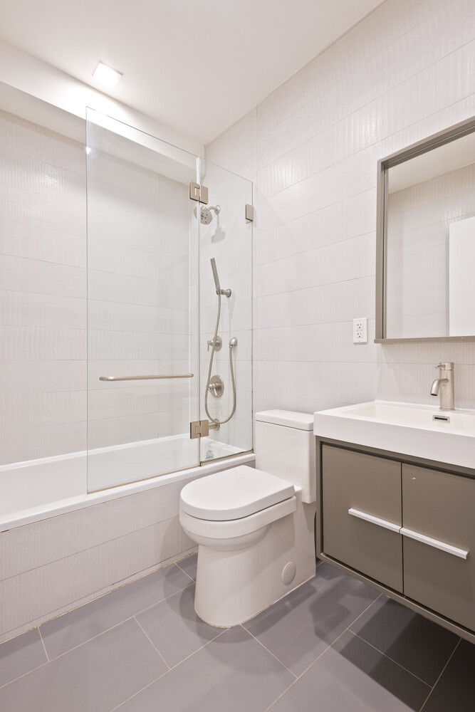 838 Quincy Street, Unit 2F Brooklyn, NY 11221 - Photo 4 of 8 a bathroom with a sink toilet and shower